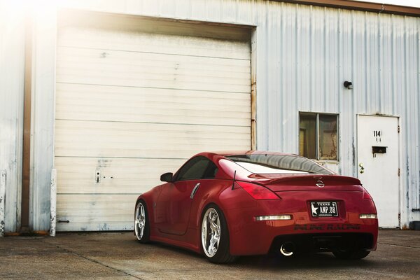 Red Nissan 350z rear on garage background