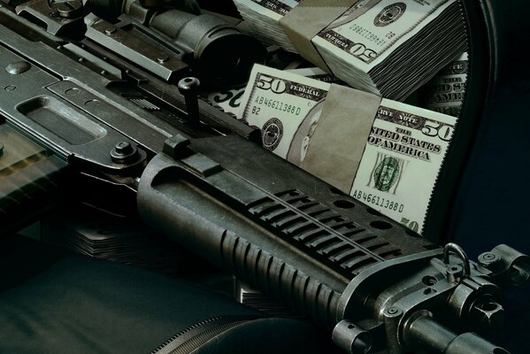 There are weapons and dollar bills in bundles