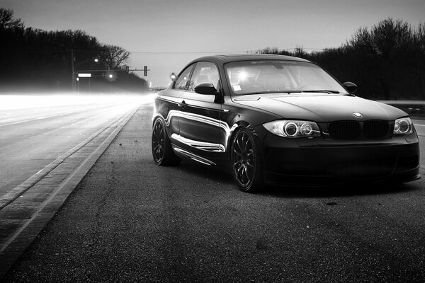 Black and white BMW on the road