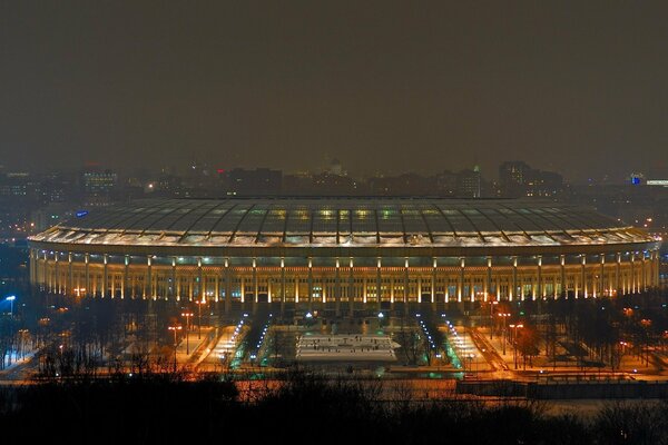 The stadium is monumentally smoldering with night lights