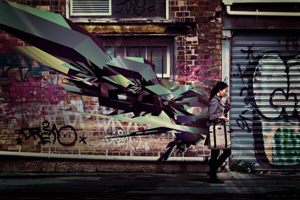 A girl on the background of a wall decorated with graffiti