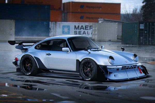 Steel white Porsche car in a race against the background of containers