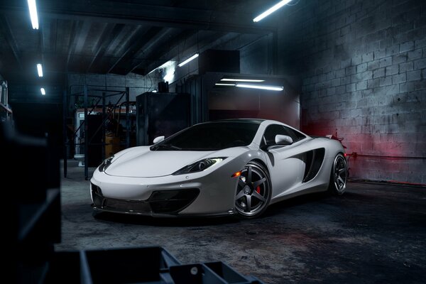 White McLaren mp4-12c supercar with alloy wheels