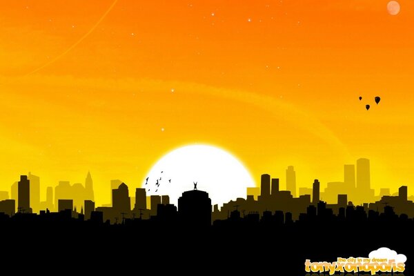 Słońce wschodzi nad miastem