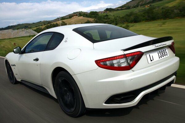 White Maserati granturismo on the road