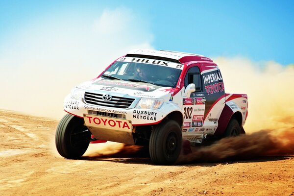 Toyota SUV car on the background of sand
