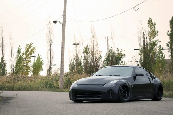 A black tuned Nissan on the road