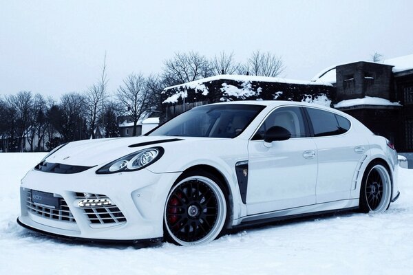 White Porsche car in the snow