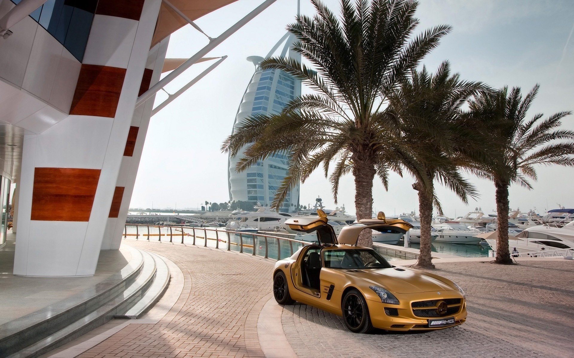 mercedes heat yachts palm trees benz dubai abu dhabi hotel road yellow mercedes sls dubai sky sea ocean sports cars transport auto motor transport