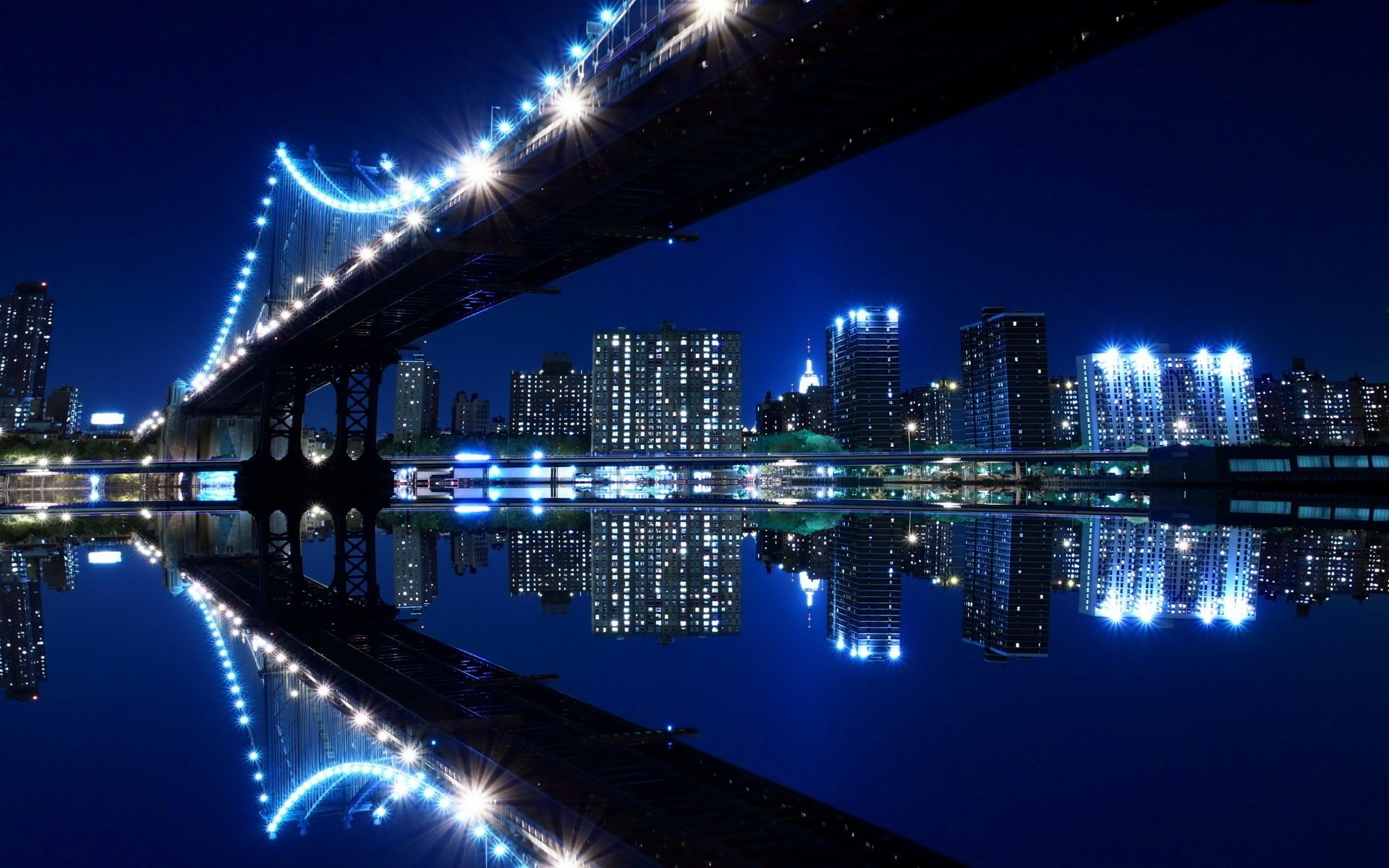 pont bleu new york rivière eau réflexion lumières nuit ville bâtiments soirée architecture ciel nocturne lumières de la ville