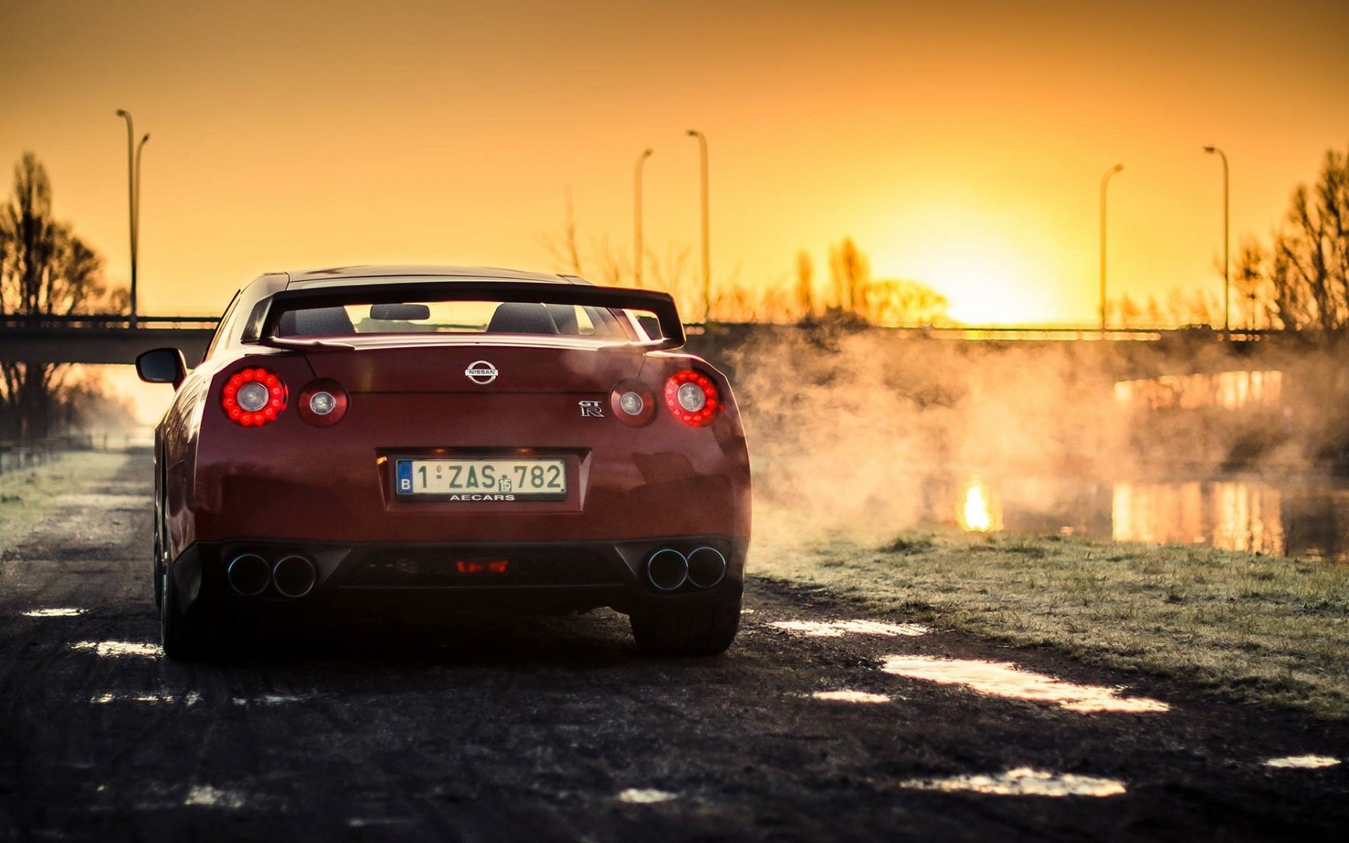 nissan r35 gt-r red sport car sun sunset rear back