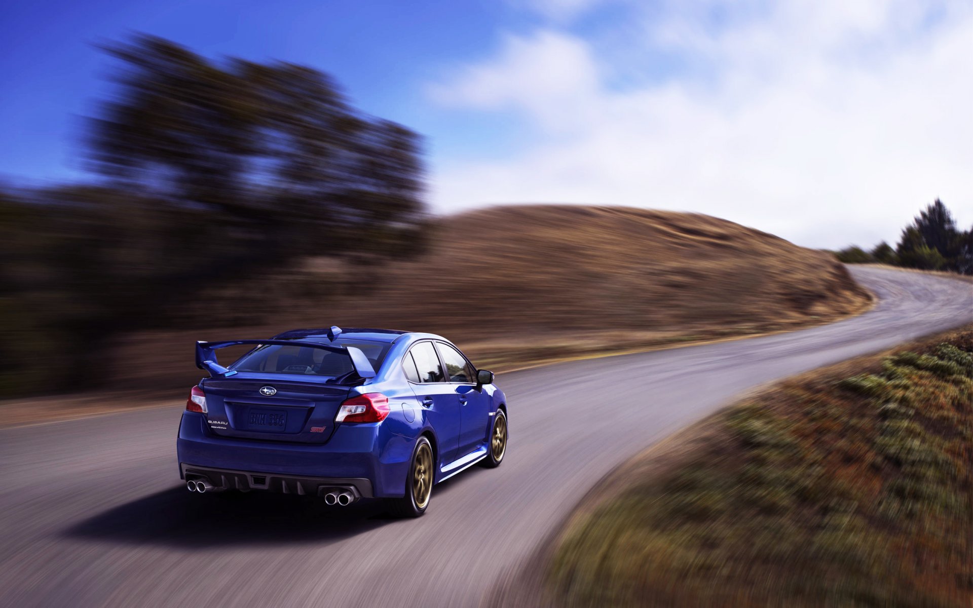 ubaru wrx sti auto voiture bleu vue arrière route jour subaru en mouvement