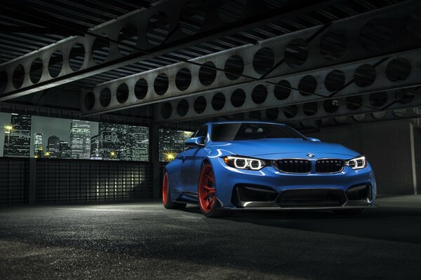 Blue BMW GTRS4 on extensions and with red Vorsteiner discs