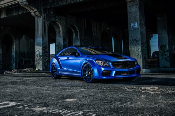 Blue Mercedes Benz in an abandoned building