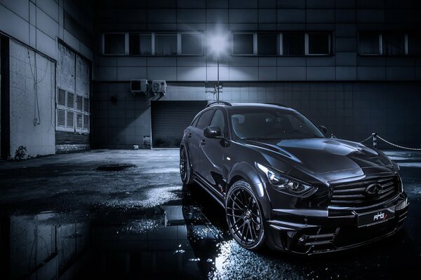 Black Infiniti in a dark alley