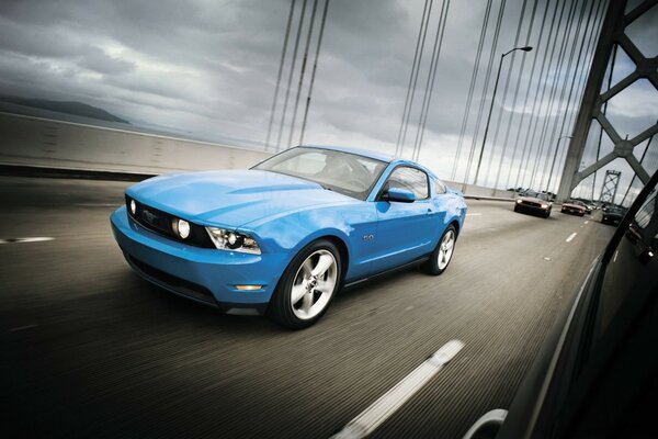 Blue Ford Mustang on the bridge
