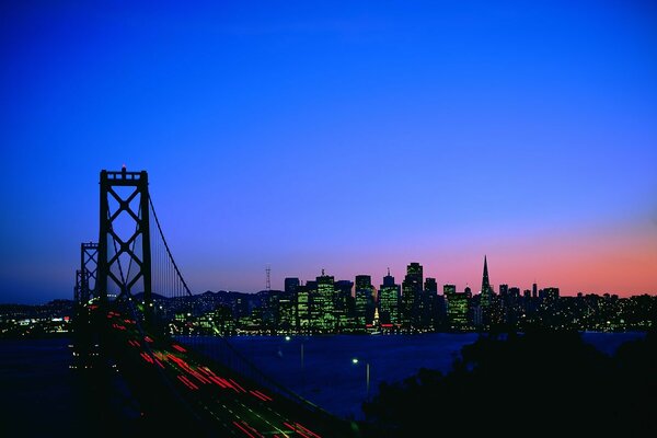 Night city. Bridge. River