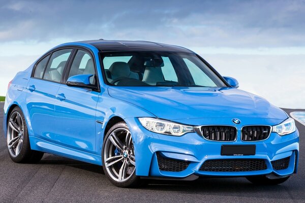 Blue BMW on a blue sky background