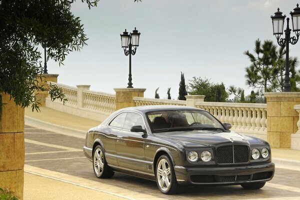 Black Bentley on the bridge with lanterns