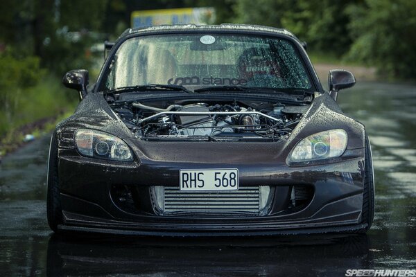 Black honda s2000 after the rain