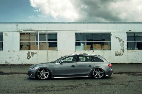 Grey audi on the wall background