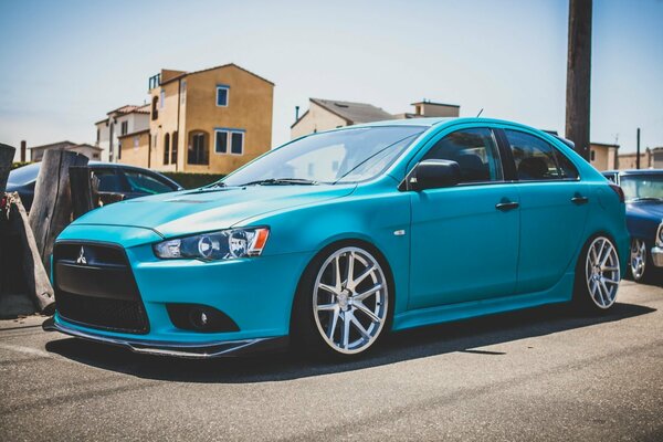 Mitsubishi lancer in the city on a sunny day