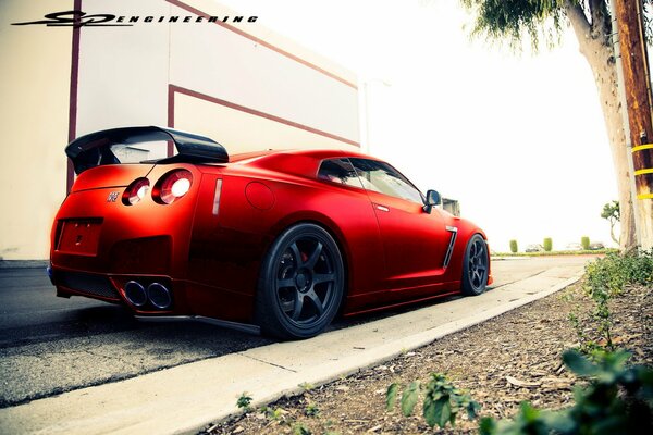 Red Nissan conqueror of the tracks