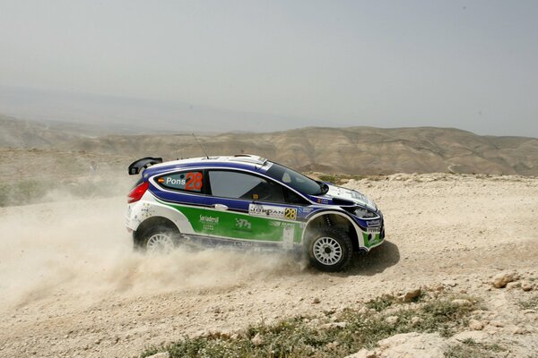 Peugeot sports car on the sand at speed