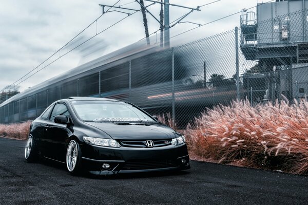 Honda Accord understated near the railway