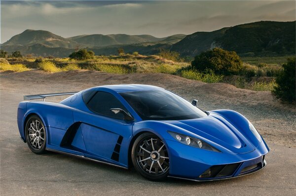 Blue supercar on the road against the backdrop of roller coasters