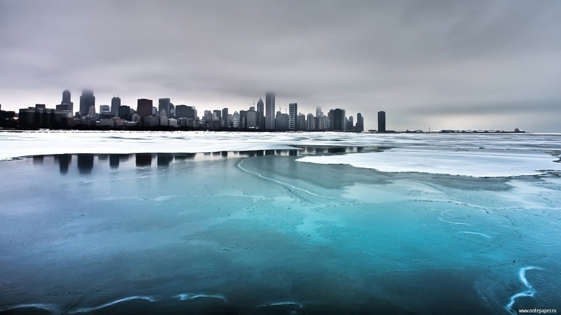 the city megapolis winter chicago lake ice the sky water skyscrapers fog cloud