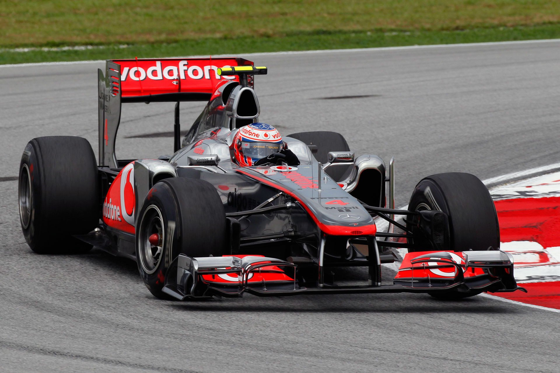 mclaren mp4-26 2011 gp malese sepang formula 1 jenson button f1 mclaren kuala lumpur velocità svolta foto motorsport