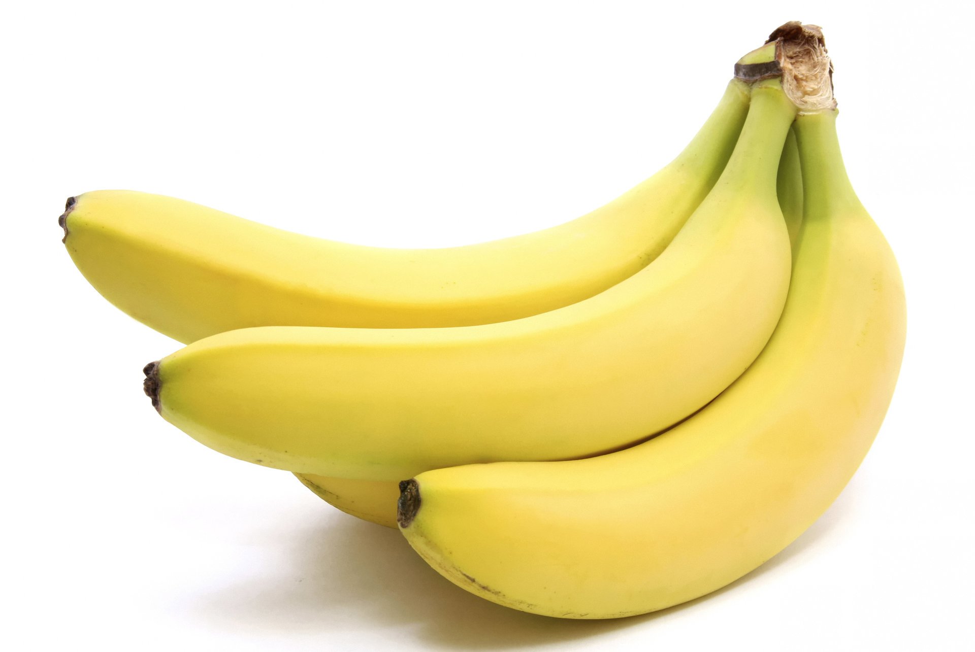 bunch of bananas bananas bananas fruits macro white background yellow light light fruit