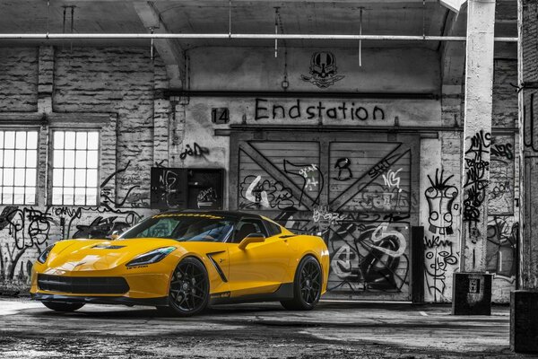 Yellow sports car in color on a black and white background