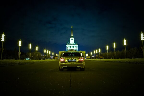 A car on a night road with lights