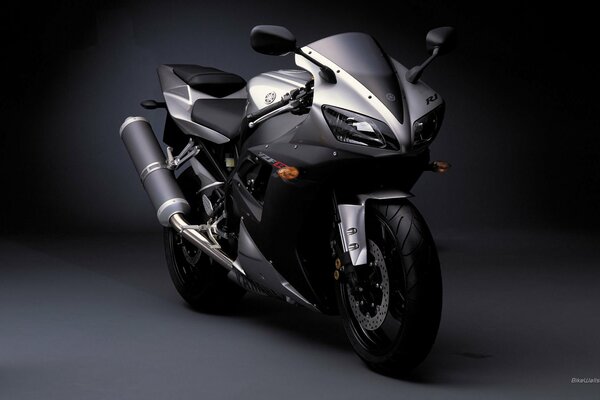 Stylish black yamaha bike on a solid background