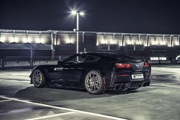 Black sports car chevrolet at night