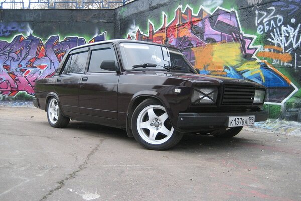 Zhiguli car on the background of a wall with graffiti