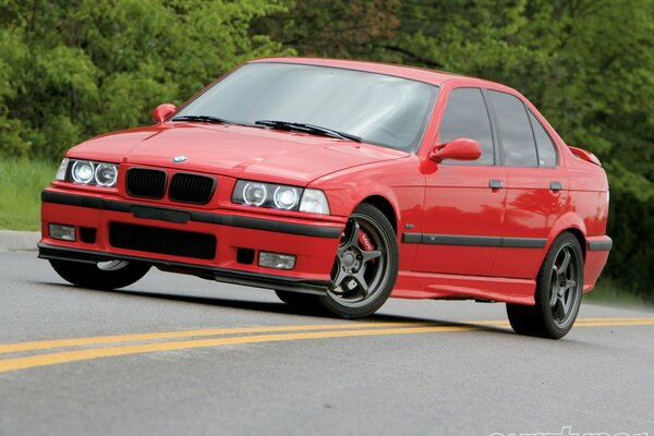 Powerful red BMW on the road