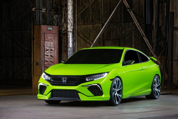 Honda civic in front of an abandoned warehouse