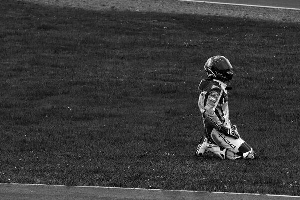 Rider in a helmet on his knees