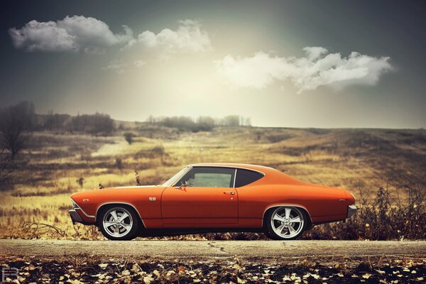 Pomarańczowy chevelle ss z 1969 roku w dolinie