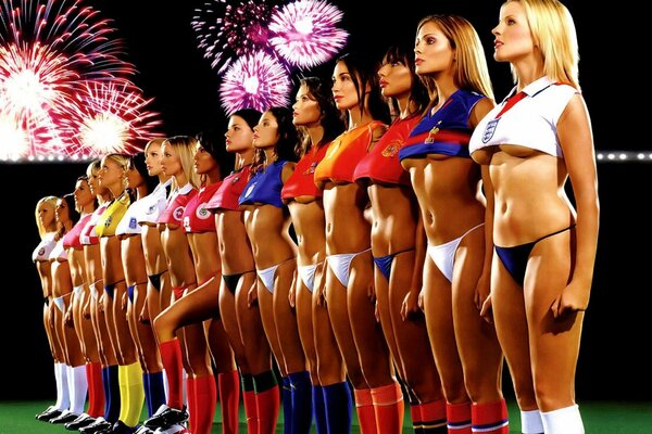 Sexy women s soccer team lined up looking at the fireworks