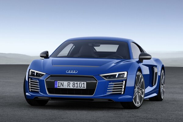 Blue audi r8 rushes towards adventure