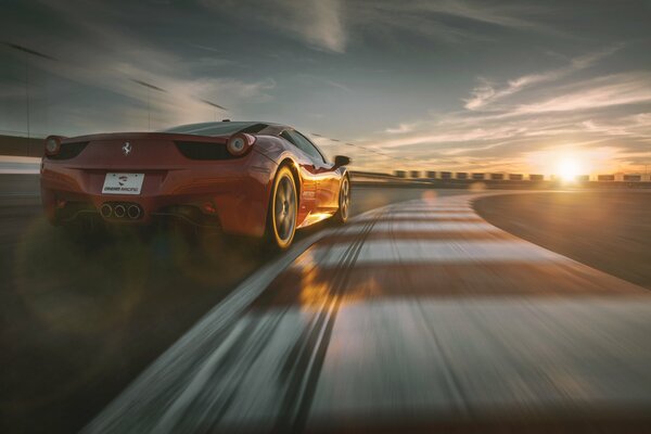 The red Ferrari is flying at speed