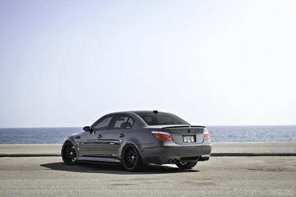 Grey BMW M5 on the ocean