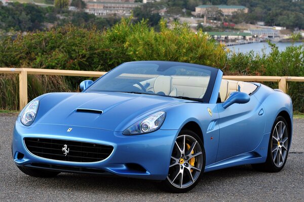 Carta da parati blu della Ferrari della bella macchina