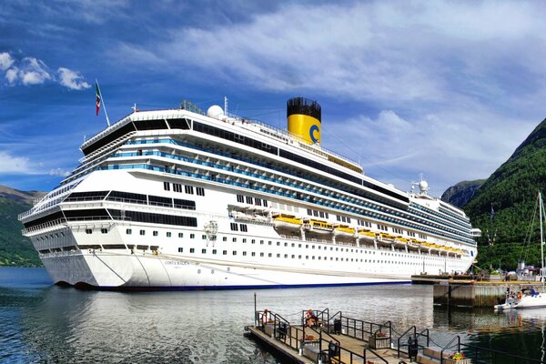 A huge passenger liner in a beautiful bay