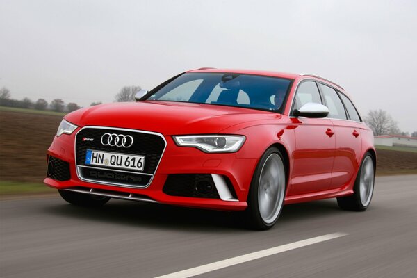 Audi rs6 red on the road at speed