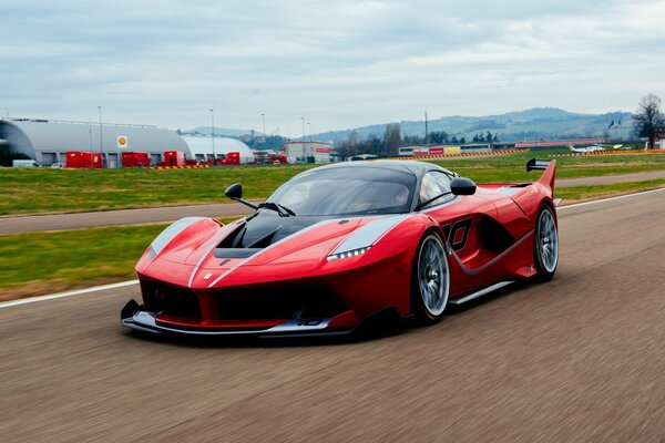 Red Ferrari with spoiler on the road